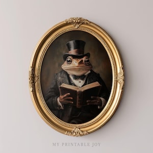 Könnte beinhalten: Ein gerahmtes Gemälde eines Kröten, das einen Zylinder und einen Anzug trägt und ein Buch hält. Der Rahmen ist golden und verziert.