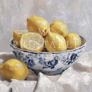 May include: A white ceramic bowl with a blue floral pattern filled with yellow lemons. The bowl is sitting on a white cloth.