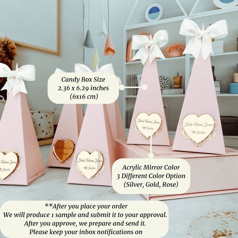 May include: Pink pyramid-shaped candy boxes with white bows and a heart-shaped mirror with the text "Dhaka Falveer Drone" in gold. The boxes are 2.36 x 6.29 inches (6x16 cm). The mirror is available in silver, gold, or rose.