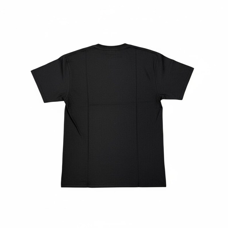 May include: A plain black t-shirt, viewed from the back, with short sleeves and a crew neck. The shirt is made of a smooth, opaque fabric and is neatly folded. The background is plain white, highlighting the shirt's simple design.