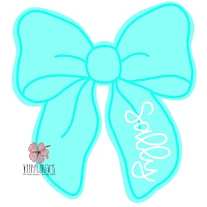 May include: A turquoise blue bow with a white outline and the word "Sassy" written in white inside the bow.