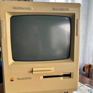 Vintage 1987 Macintosh Plus. Keyboard, mouse, monitor, and computer.