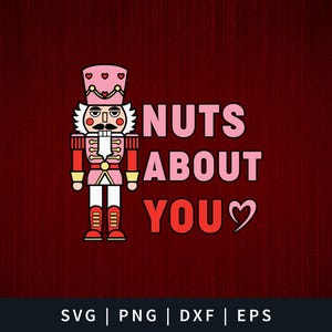 May include: A pink and red nutcracker with a heart on its hat, with the text "NUTS ABOUT YOU" in pink and red letters with a heart.