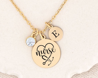 May include: Gold necklace with a heart charm that says "nurse" with a stethoscope inside the heart. There is also a small crystal charm and a charm with the letter "E" on it.