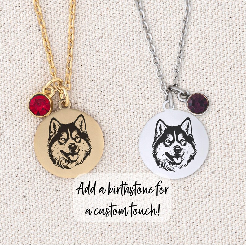 May include: Two silver necklaces with a round pendant featuring a black and white husky silhouette. One necklace has a red birthstone and the other has a purple birthstone. The text "Add a birthstone for a custom touch!" is below the necklaces.