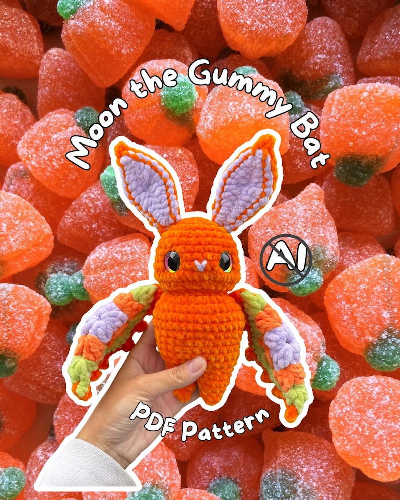 May include: A crochet bat toy named Moon the Gummy Bat with an orange body, lavender inner ears, and multicoloured wings in orange, lavender, and light green. The text Moon the Gummy Bat and PDF Pattern is visible on the image.