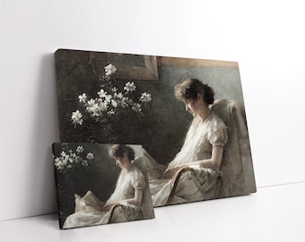 May include: A vintage painting of a woman in a white dress sitting in a chair and reading a book. The painting is set in a room with a window and a vase of white flowers.