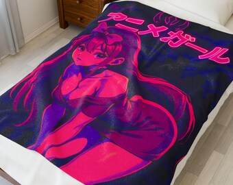 May include: A blanket featuring a vibrant anime-style illustration of a woman in shades of pink and purple against a dark blue background. Japanese text is visible at the top. The blanket is spread over a bed with a white sheet.