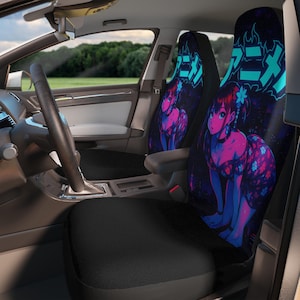 May include: Car seat covers featuring a vibrant anime-style illustration of a woman in a floral dress, rendered in shades of pink and blue. The design includes Japanese text in a neon blue font against a dark background.