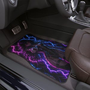 May include: A rectangular car floor mat featuring a vibrant graphic print of an anime-style character surrounded by glowing purple and blue lightning bolts. The design includes dark tones with high-contrast neon electrical energy effects.