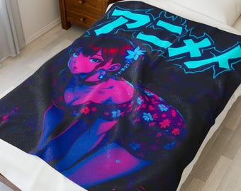 May include: A black blanket featuring a vibrant anime-style illustration of a woman with blue and pink tones. The blanket has the word "Anime" in blue Japanese characters across the top. The woman is wearing a floral dress.