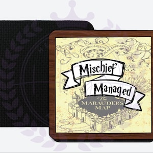 May include: A wooden coaster with a vintage-style illustration of Hogwarts castle and the text "Mischief Managed" on a white banner. The text "The Marauder's Map" is also included. The coaster has a black backing.