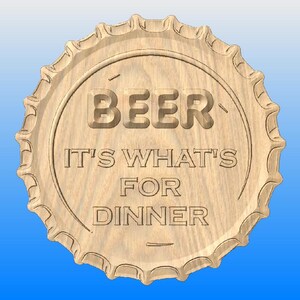 May include: A wooden beer bottle cap design with the words "BEER IT'S WHAT'S FOR DINNER" carved into the wood. The cap is light brown with a scalloped edge, set against a blue background.