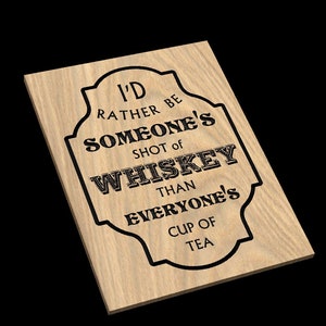 May include: Wooden sign with a black border and the text "I'd rather be someone's shot of whiskey than everyone's cup of tea."