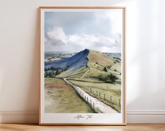 May include: A framed landscape print featuring a mountain and a winding path. The artwork showcases a green and brown hillside under a cloudy sky. The print is in a wooden frame and has the text "Mam Tor" at the bottom.