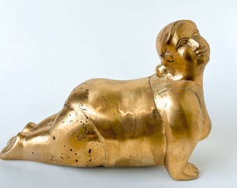 Brass women shaped statue