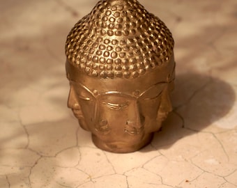 Brass Buddha head with a gaze in all directions