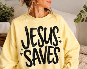 Jesus Saves PNG, Christian Sweatshirt Design, Retro Faith Shirt Graphic, Trendy Christian PNG, Distressed Typography Design, Boutique Christ