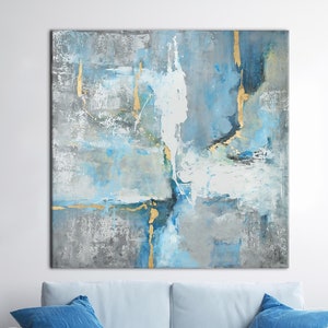 May include: Abstract painting with blue, gray, and gold accents. The painting features a textured, layered style with bold strokes and splashes of color.
