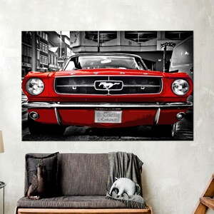 May include: A red classic Ford Mustang with a black and white background. The car has a chrome bumper and a license plate that reads "True Romance".