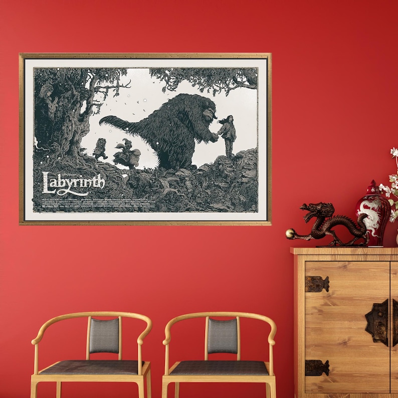 May include: A black and white illustration of a scene from the film Labyrinth. The illustration features a large, furry creature with a human-like face, a young girl, and a group of smaller creatures. The text "Labyrinth" is printed at the bottom of the illustration.
