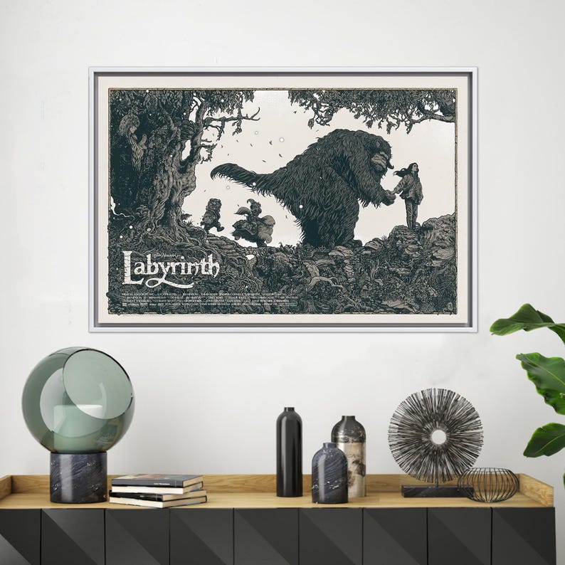 May include: A black and white illustration of a scene from the film Labyrinth. The illustration features a large, furry creature with a girl standing next to it. The text "Labyrinth" is printed at the bottom of the illustration.