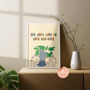 May include: A digital download print with a yellow background featuring a line drawing of a head with plants growing out of it. The text "you don't have to earn self-care" is written in rainbow colors.