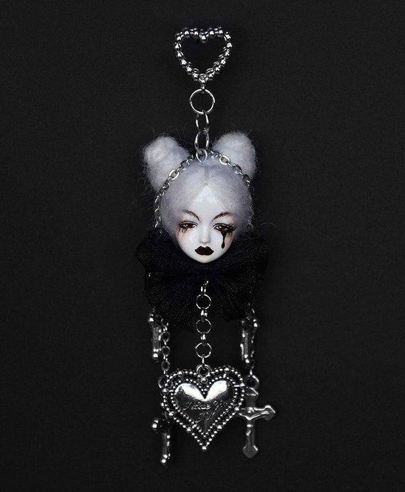 Limited-edition 'Black Tear' doll earrings with 572 favorites — creepy-cute handmade jewelry that straddles the line between haunted and adorable in the best way.
