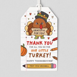 May include: Thanksgiving gift tag with a cartoon turkey wearing a hat and holding a sign that says "Grateful for You!" The tag also says "Thank You" and "Happy Thanksgiving!" with a pencil at the bottom.