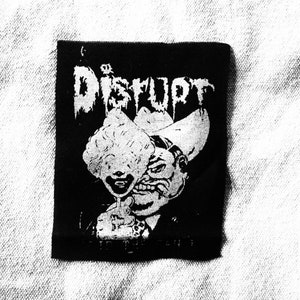 May include: Black and white patch with the word "Distrupt" in a stylized font. The patch features a cartoon image of a person with a large hat and a wide grin.