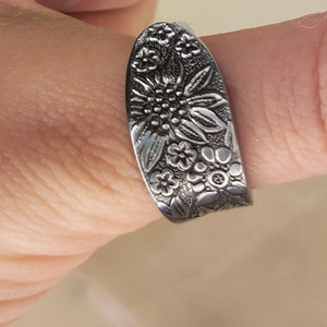Floral covered steel spoon ring
