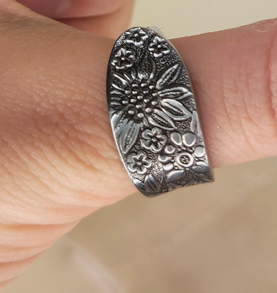 Floral covered steel spoon ring