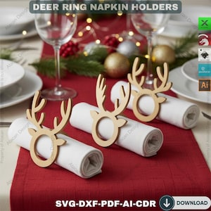 May include: Wooden deer ring napkin holders on a red tablecloth. The holders are shaped like deer antlers and encircle rolled white napkins. The image includes text that reads "DEER RING NAPKIN HOLDERS".