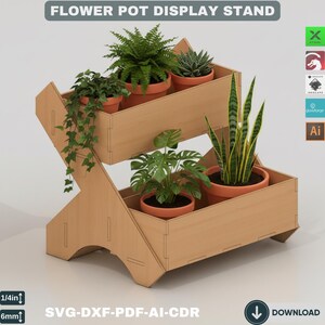 May include: A two-tiered wooden flower pot display stand. The stand holds several terracotta pots with various green plants. The text "FLOWER POT DISPLAY STAND" is at the top. The stand is made of light-coloured wood and has a modern design. The stand is 6 mm thick.