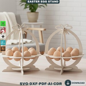 May include: Two wooden Easter egg stands, each holding a dozen brown eggs. The stands are light-colored, with a basket-like design and a decorative bow at the top. The text "EASTER EGG STAND" is at the top. The bottom of the image has the text "SVG-DXF-PDF-AI-CDR" and a download icon.