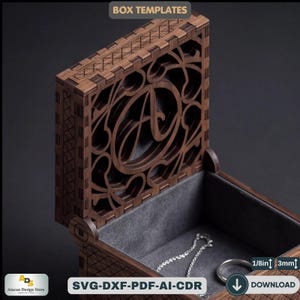Puede incluir: Una caja de madera con tapa abierta, con intrincados diseños cortados con láser y la letra "A". La caja está forrada con tela gris y contiene una cadena y un anillo plateados. El texto "BOX TEMPLATES" está en la parte superior.