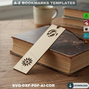 May include: A light-colored wooden bookmark with a flower and a circular design cut out. The bookmark is lying on top of a closed book. The text "A-Z BOOKMARKS TEMPLATES" is at the top of the image, and "SVG-DXF-PDF-AI-CDR" is at the bottom.