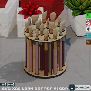 May include: A wooden paintbrush holder with 18 slots for storing brushes. The holder is made of light brown wood and has a circular base. The holder is designed to hold paintbrushes upright and organized.