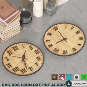 May include: Two wooden clocks with Roman numerals. The clocks have a light brown wood grain face with dark brown hands and a dark brown border. The clocks are round and appear to be laser cut. The image also includes books and other objects.