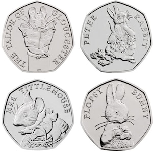 May include: Four silver collector's coins featuring characters from Beatrix Potter's children's books. The coins feature Peter Rabbit, Mrs. Tiggy-Winkle, Flopsy Bunny, and the Tailor of Gloucester.