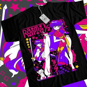 May include: Black t-shirt with a colorful graphic of a female anime character with a sword and a cat. The text "Ranma 1/2" is printed on the shirt.