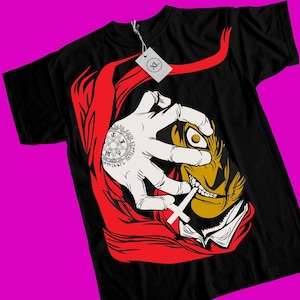 May include: Black t-shirt with a red and white graphic of a character with a single eye, a cross, and a pentagram. The character is wearing a red cloak and has a sinister expression.