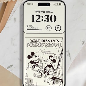 K&ouml;nnte beinhalten: Ein Smartphone, auf dem ein Schwarzwei&szlig;-Comic-Panel mit Mickey Mouse und Minnie Mouse zu sehen ist. Das Panel stammt aus dem Walt Disney Comic Mickey Mouse und zeigt den Text "Building a Building".