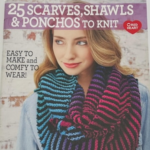 May include: A book cover with the title "25 Scarves, Shawls & Ponchos to Knit" features a woman wearing a colorful knitted scarf. The scarf transitions from blue to purple to pink. The text "Easy to Make and Comfy to Wear!" is also visible.