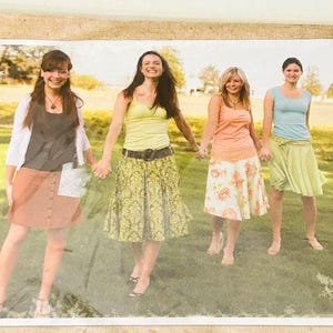 May include: Four individuals wearing casual summer clothing: a dark top with a white cardigan and coral skirt, a lime green tank top with a patterned yellow skirt, a peach tank top with a floral skirt, and a light blue tank top with a lime green skirt.