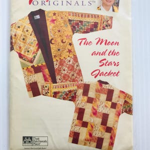 May include: A book cover featuring a patchwork jacket design with celestial motifs. The jacket is primarily yellow with red, brown, and cream accents, and the text "The Moon and the Stars Jacket" is displayed in red script. The book is from That Patchwork Place.