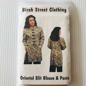 May include: A package for an Oriental Slit Blouse & Pants sewing pattern from Birch Street Clothing. The pattern features a woman wearing a long-sleeved blouse and pants with a leopard print design. The blouse has black buttons.
