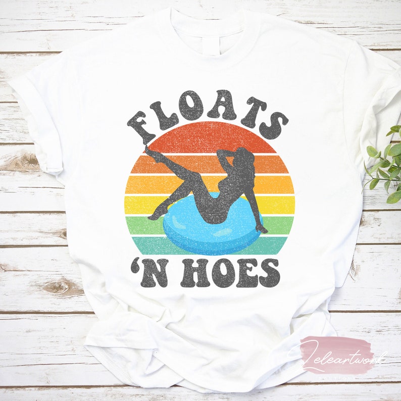 May include: White t-shirt with a vintage-style graphic of a person floating on a pool float with the text "FLOATS 'N HOES" in black.