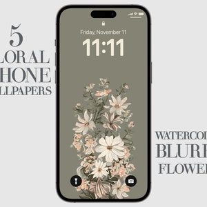 May include: A digital phone screen with a floral wallpaper. The wallpaper features a watercolour style bouquet of pink and white flowers on a green background. The time is 11:11 and the date is Friday, November 11. The text "WATERCOLOR BLURRY FLOWERS" is displayed at the bottom of the screen.