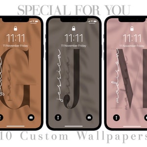 May include: Three iPhone mockups with different colored backgrounds and a large letter in the center of each screen. The letters are G, J, and M. The time is 11:11 and the date is 11 November Friday on each screen. The text "grace", "jessica", and "madison" is written in cursive on each screen. The text "10 Custom Wallpapers" is written below the mockups.